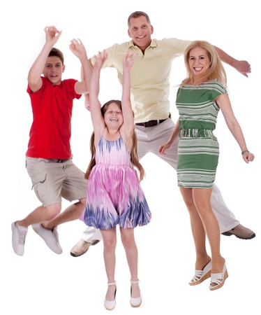 Cheerful family jumping to the air and having fun  over white backgroundの写真素材