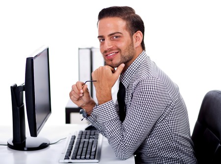 Young business man at the office on white isolated backgroundの写真素材