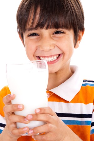 Young kid with glass of milk isoalted on white backgroundの写真素材