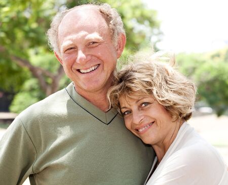 Loving, handsome senior couple posing in styleの写真素材