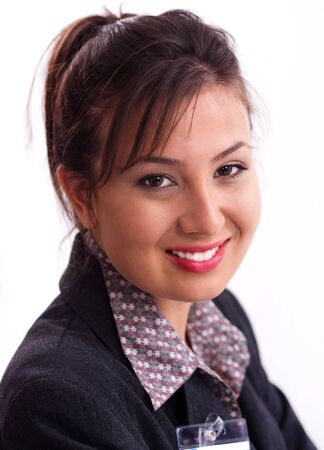 Close up of confident friendly young businesslady smiling at cameraの写真素材