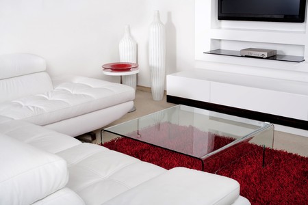Modern living space with white leather couchの写真素材