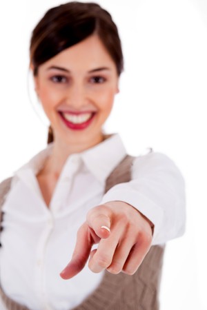 Portrait of an attractive young woman pointing her finger on white backgroundの写真素材
