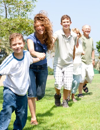 portrait of happy family making hand chain holding each otherの写真素材