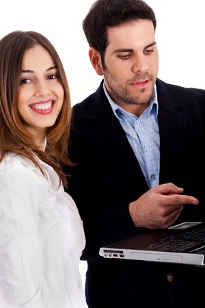 Closeup view of couple with laptop discussing on white backgroundの写真素材