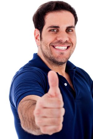 portrait of young man showing thumbs up gesture on an isolated backgroundの写真素材