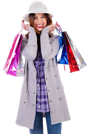Portarit of smiling lady posing with shoppings bags in her both handsの写真素材