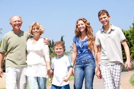 portrait of a happy family standing outdoorの写真素材