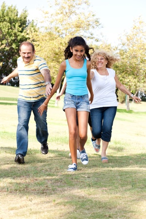 Young family having fun in park...の写真素材