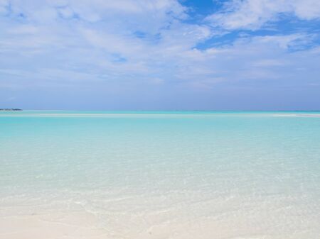 A seascape with beautiful clouds and turquoise ocean.の写真素材