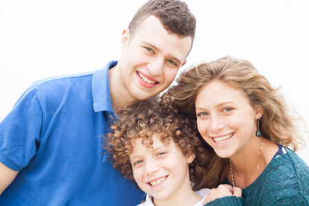 Beautiful happy couple with his sonの写真素材