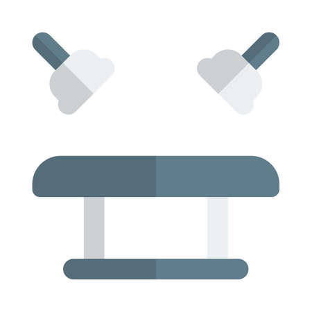 Hospital with a bed and light setup for surgeryのイラスト素材