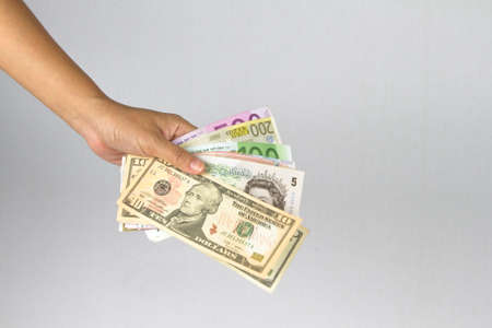 Woman Hand give money on white background