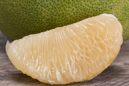 fresh pomelo on wood floor