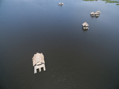 Aerial view from drone. group resort house raft floating in the lake for relax timeの写真素材
