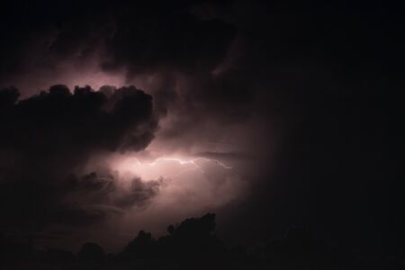 Lightning bolt in the rainstorm and big cloud at night. thunder bolt feel dangerous.