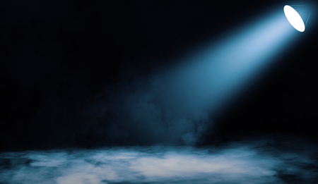 Colorful projector. Spotlight stage with smoke on the floor . Isolated background.