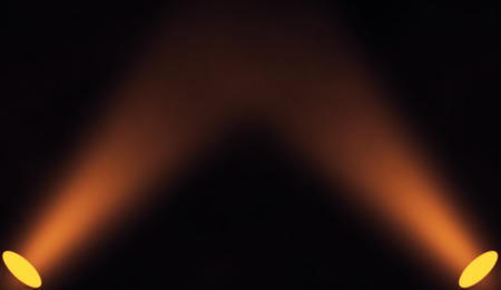 Colorful projector on the floor . Stage on isolated black background.の写真素材