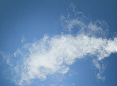 White smoke on blue background の写真素材