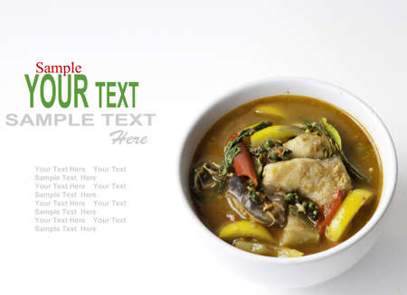 Thai style food Red curry cook with Asian Redtail Catfish and herb. の写真素材