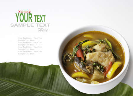 Thai style food Red curry cook with Asian Redtail Catfish and herb. の写真素材