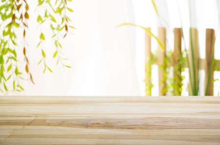 Emty wood table  with garden background close-up look at wooden in morning bright  for product display or design key visual layoutの写真素材