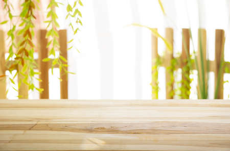 Emty wood table  with garden background close-up look at wooden in morning bright  for product display or design key visual layoutの写真素材