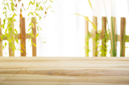 Emty wood table  with garden background close-up look at wooden in morning bright  for product display or design key visual layoutの写真素材