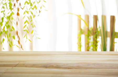 Emty wood table  with garden background close-up look at wooden in morning bright  for product display or design key visual layoutの写真素材