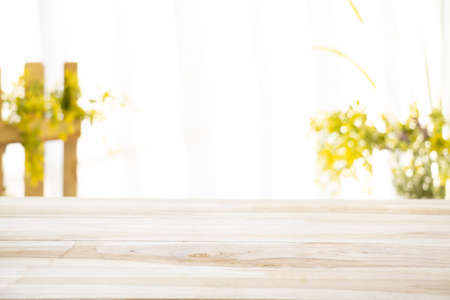 Emty wood table  with garden background close-up look at wooden in morning bright  for product display or design key visual layoutの写真素材