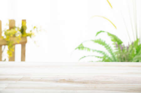 Emty wood table  with garden background close-up look at wooden in morning bright  for product display or design key visual layoutの写真素材