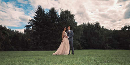 Wedding tour of the bride and groom in the forestの写真素材