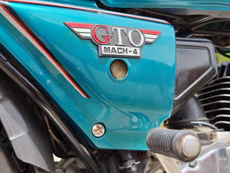 Songkhla, Thailand, October 10, 2021 - Kawasaki GTO Mach-4 Blue color on gravel road.