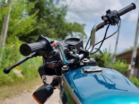 Songkhla, Thailand, October 10, 2021 - Kawasaki GTO Mach-4 Blue color on gravel road.