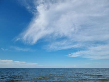 Blue sea waters and blue sky horizon.の写真素材