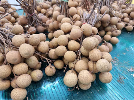 A number of fresh Longan in fruit market. for sale in a Thailand market