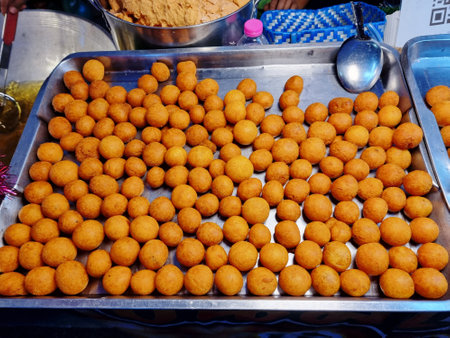 'Fried Sweet Potato and Taro balls'. Appetizer Thailand ancient has a nickname called turtle eggs or quail eggs made by sweet potatoes mix wheat flour then frying oilの写真素材
