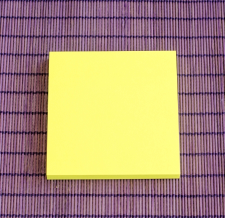 yellow note on purple backgroundの写真素材