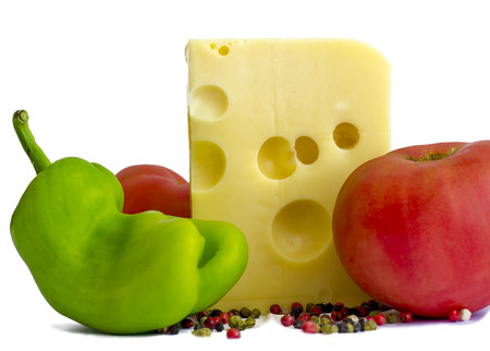 Emmental cheese with tomatoes, pepper isolated on white backgroundの写真素材