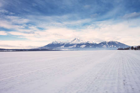 View to High Tatras mountain range covered by snow in winter time, Slovakiaの写真素材