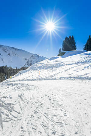 View to red ski slope in a beuatiful sunny weather in Klewenalps ski resort, Central Siwtzerlandの写真素材