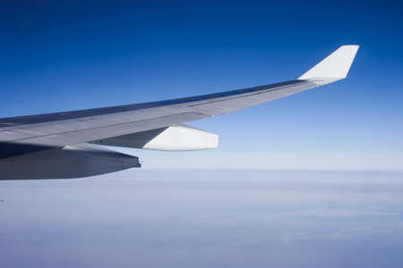 Clouds and aeroplane wingの写真素材