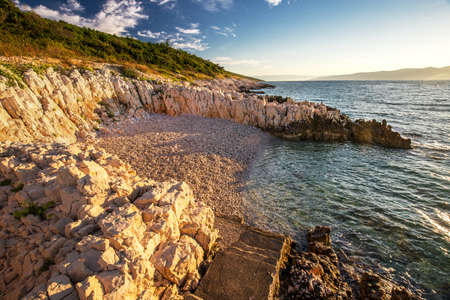 Sunrise over the rocky beach on the coast of Adriatic Sea, Istria, Croatiaの写真素材