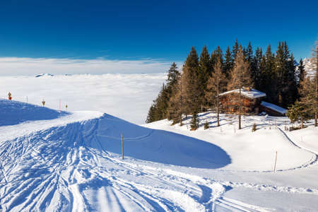 Alpine chalet covered by snow in Kitzbuehel ski arena, Tyrol, Austriaのeditorial素材