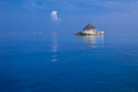 Overwater bungalows with tourquise clear water in tropical islandのeditorial素材