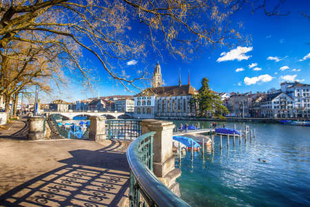 ZUERICH, SWITZERLAND - February 11, 2016 - View of historic Zurich city center with famous Grossmunster Church, Limmat river and Zurich lake. Zuerich is the largest city in Switzerland and the capital of the canton of Zuerich.のeditorial素材