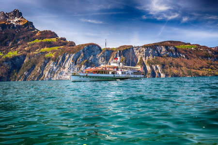 Steam boat on lake Lucerne with view to Swiss Alps from Sisikon, Switzerland.