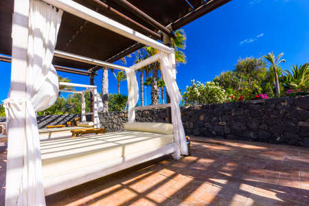 Beach lounge in luxurious tropical resort.のeditorial素材