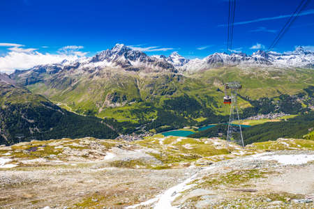 People in Corvatsch cable car enjoying the stunning view of Silsersee, Silvaplanersee, Engadin valley and Maloja near Sankt Moritz, Grisons, Switzerland, Europe.のeditorial素材