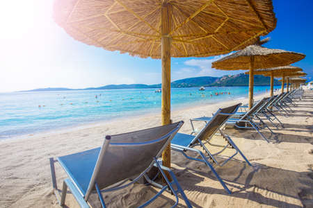 Beach chairs with a white sand on San Ciprianu beach near Porto-Vecchio in Corsica, France, Europeの写真素材